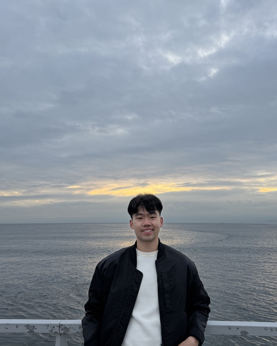 Chua Meng Yong by the water at sunset